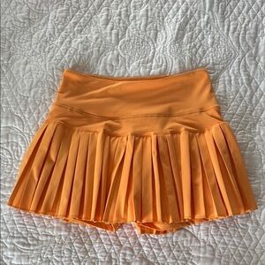 Pleated Orange Mini Skirt